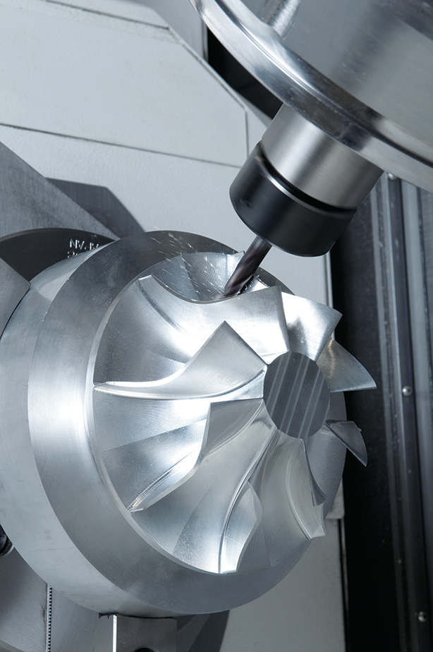 CNC machining a precision metal impeller.